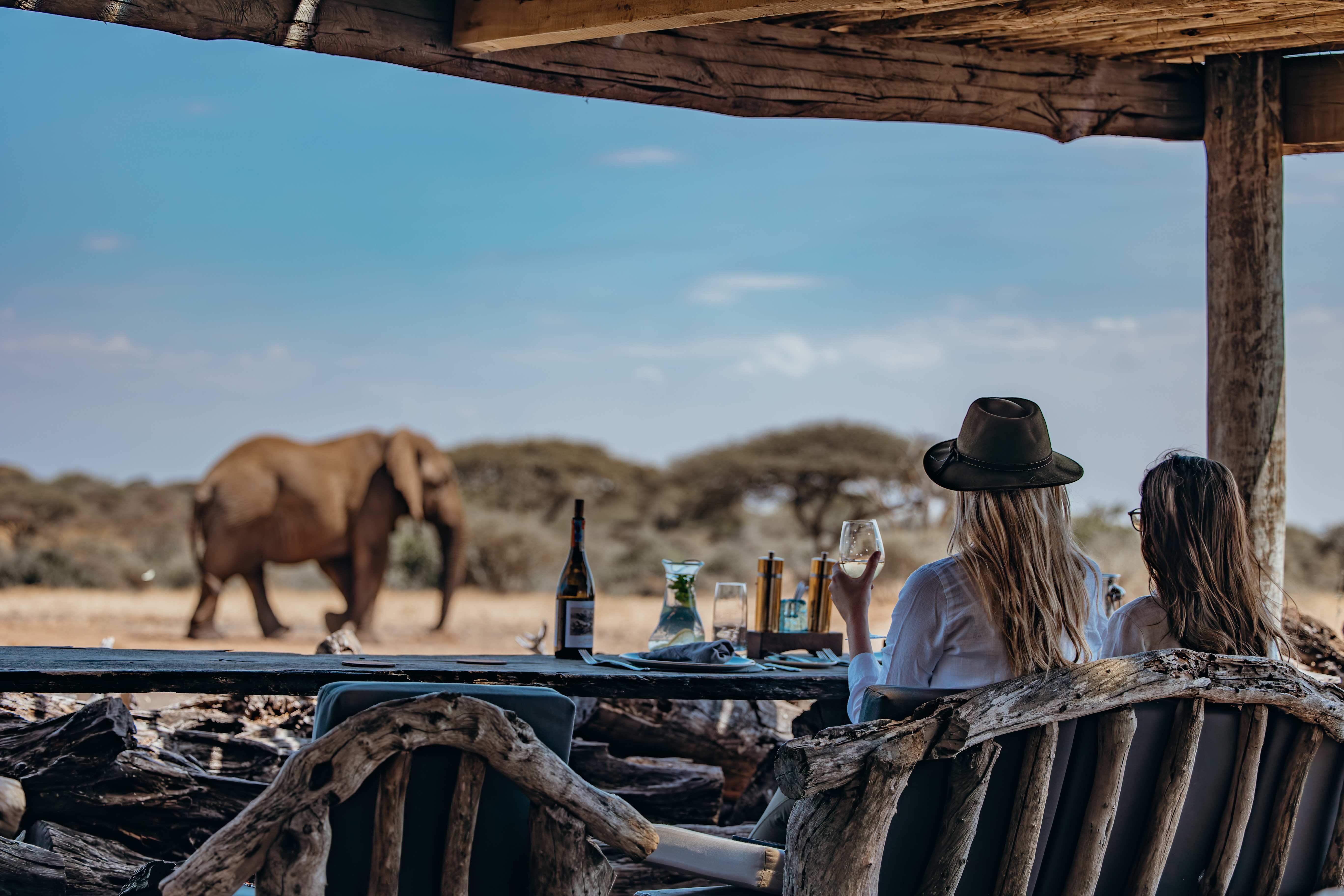 Luxury safari lodge suite overlooking East Africa at sunset