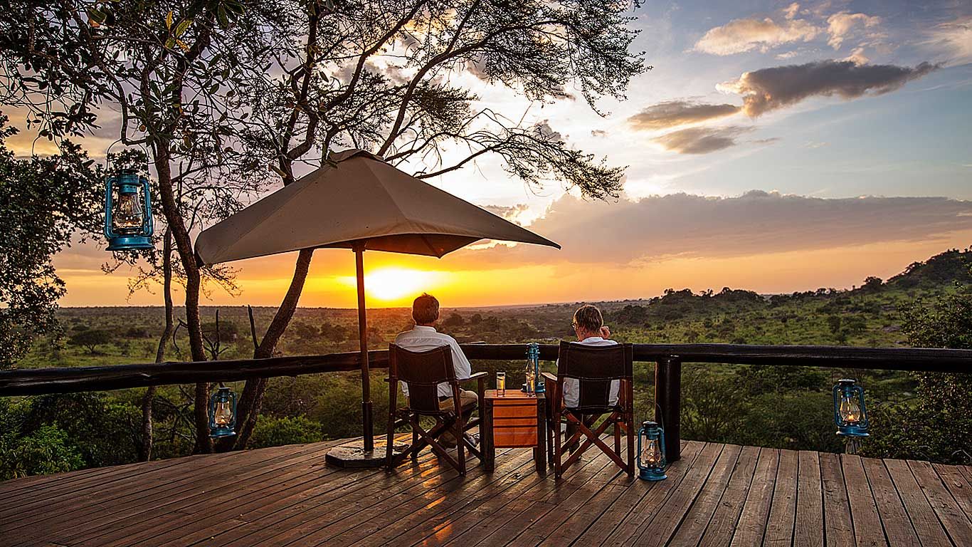 Camp deck overlooking the northern Serengeti plains on a 10 day Rwanda Kenya Tanzania safari
