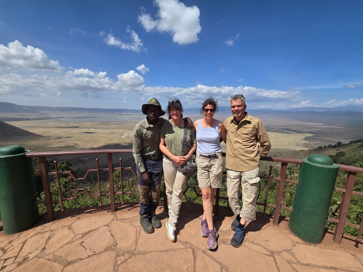 Guests and their guide standing at a viewpoint above the Ngorongoro Crater